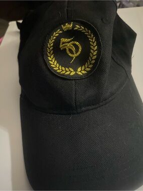 Source Unknown Black Cap with Gold Laurel Emblem